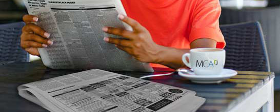 Person looking at help wanted section in the newspaper Place National labor certification Newspaper advertising in any publication in the country in full compliance with the DOL