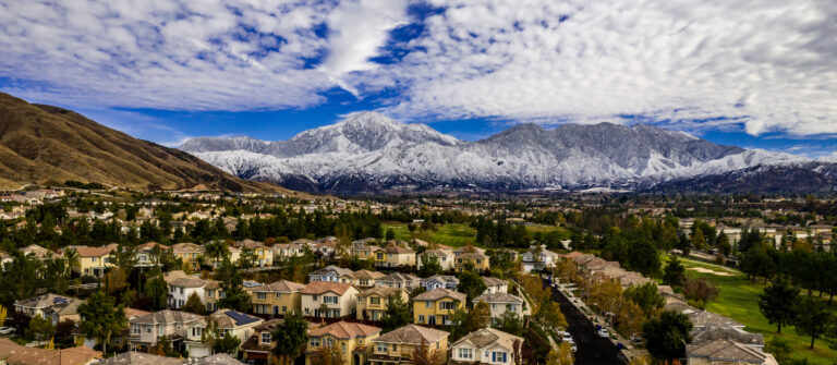 Aerial view of snow covered San Gorgonio and Little San Bernardino Mountains above Yucaipa, California, Place ads in the San Bernardino Sun