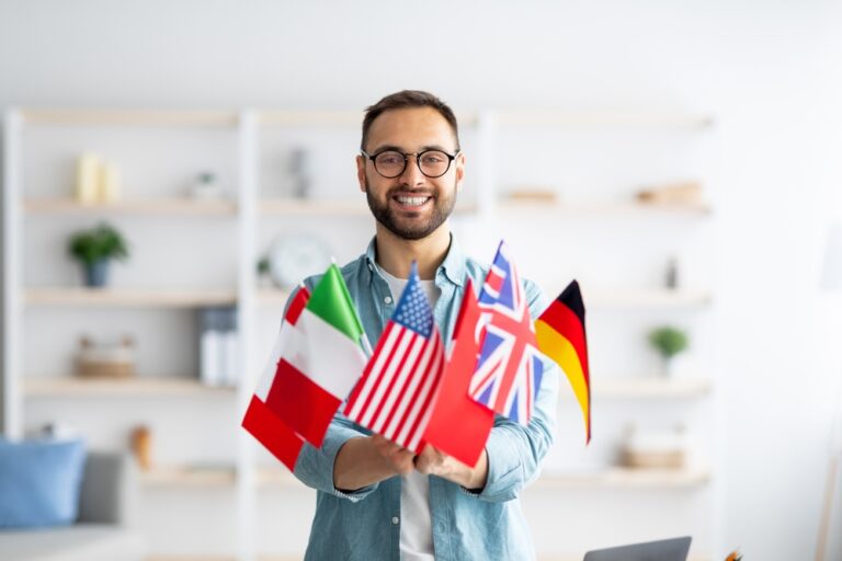 man holding flags from different countries to portray labor certification marketing