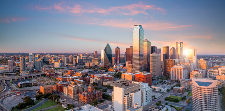 Dallas, Texas cityscape with blue sky at sunset, Texas Advertise in the Dallas Morning News