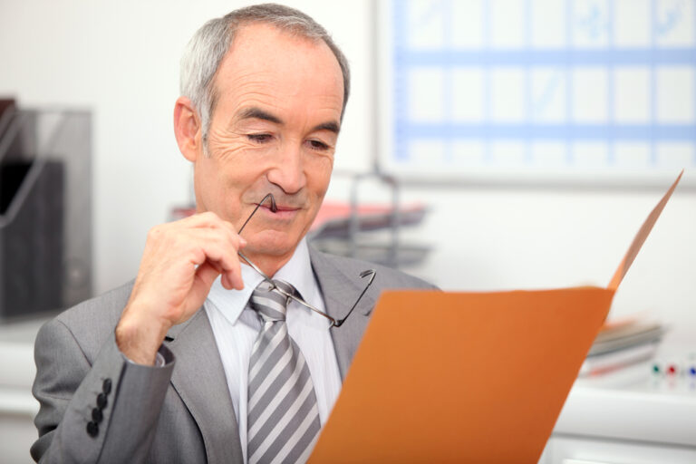 man reading a completed Request for Proposal for Legal and Public Notices